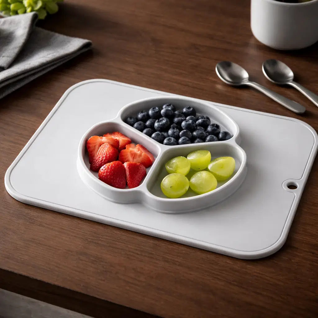 Giggle Bubs baby silicone non-slip plate with placemat featuring fruits in three compartments.
