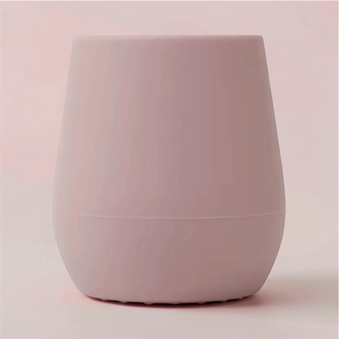 Mini EzyPzy Cup in soft pink silicone, designed for toddlers to transition from bottle to cup.