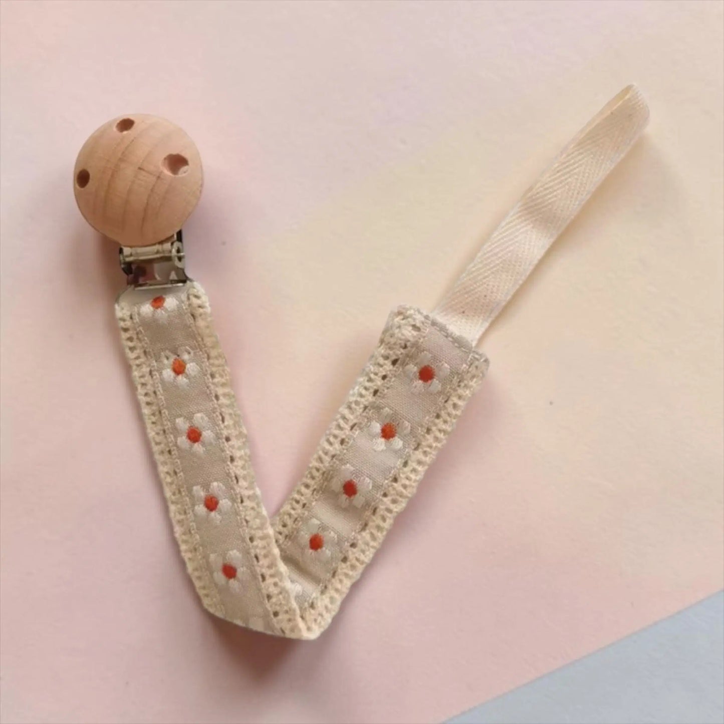 Giggle Bubs luxe dummy clip for babies with natural wooden holder and soft fabric strap.