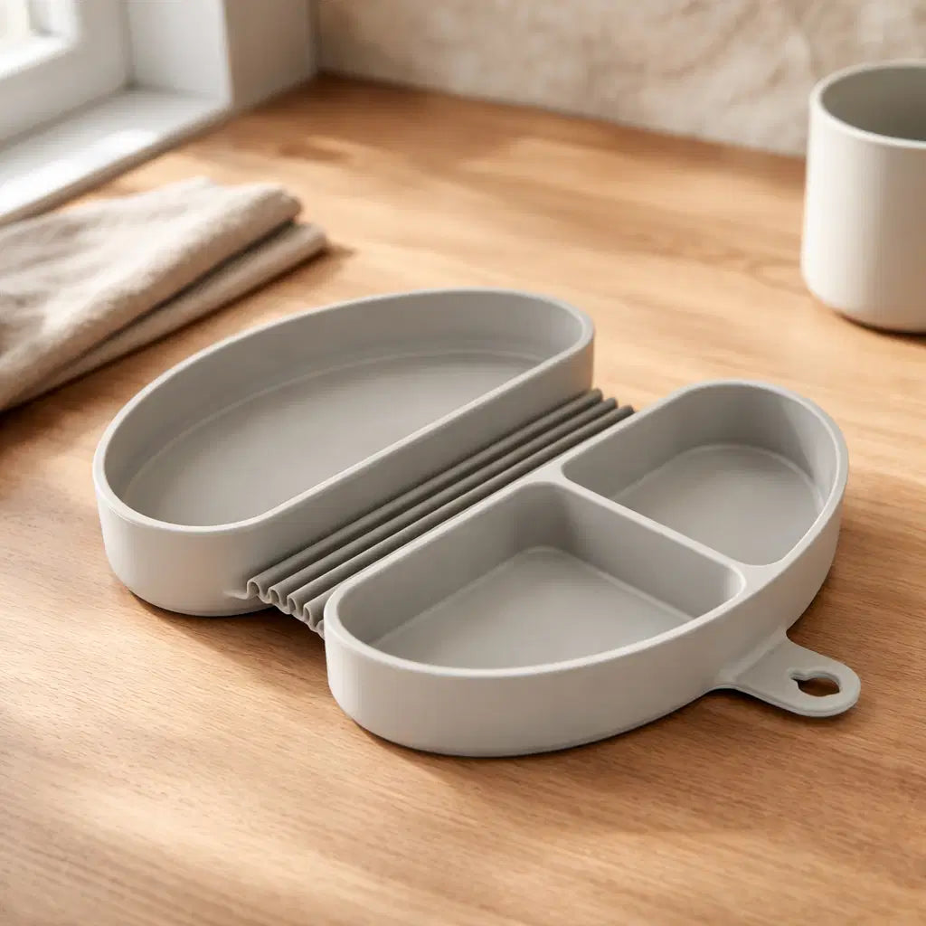 Foldable silicone kids meal box in gray color, designed for mess-free meals with multiple compartments.