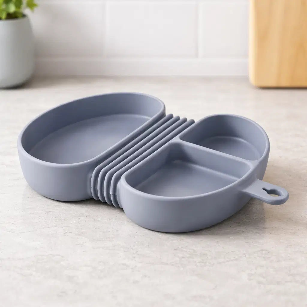 Foldable silicone kids meal box in gray, designed for mess-free toddler meals on the go.