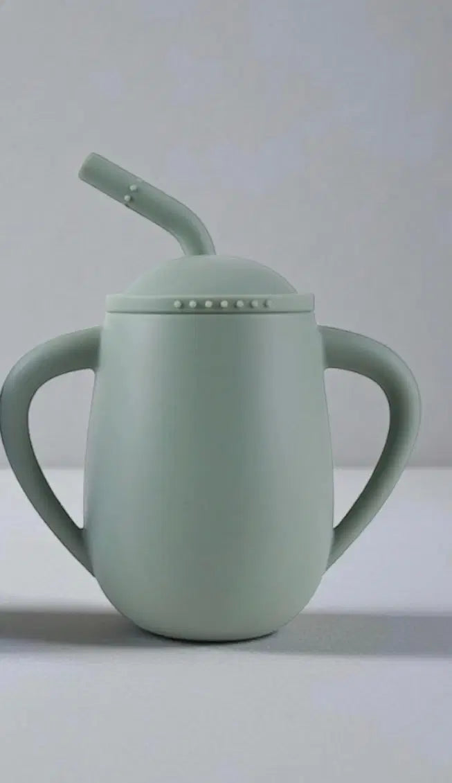 Giggle Bubs EasySip toddler silicone straw cup in soft green color for toddlers learning independent drinking.