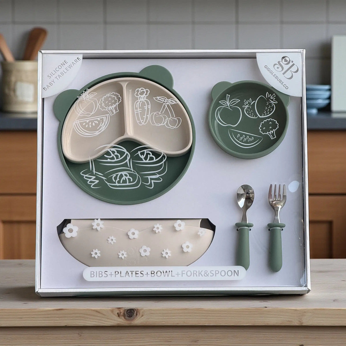 Bubs Universe olive silicone baby feeding set including suction plate, bowl, bib, and cutlery in a gift box.